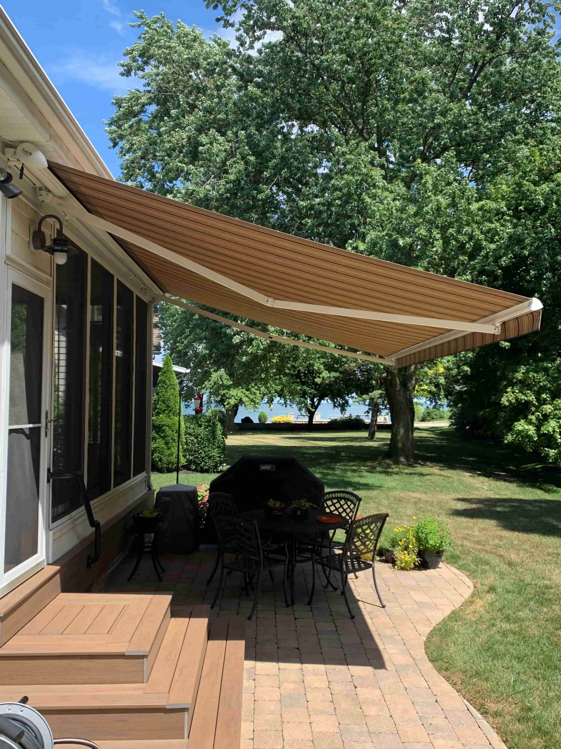 Awning casting large area of shade on patio table underneath